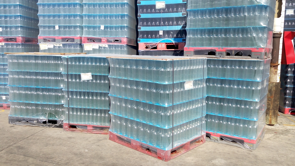 久牛包裝助力玻璃瓶廠(chǎng)家使用電動(dòng)打包機(jī)提升玻璃瓶包裝速度